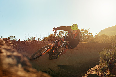 Buy stock photo Man, cycling and extreme sport with mountain bike on dirt road for cardio workout, outdoor adventure or adrenaline rush. Male person, cyclist or riding with bicycle on track, trail or path for speed