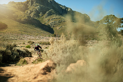 Buy stock photo Bike, speed and trail with man in mountains for outdoor exercise, fitness or hobby. Adventure, scenic and view with cyclist person riding in nature for challenge, performance or sports training