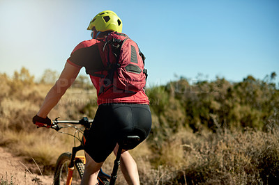 Buy stock photo Fitness, nature and back of cyclist with exercise, challenge or cardio workout for endurance. Sports, outdoor and athlete riding mountain bike for cycling race, competition or triathlon training.