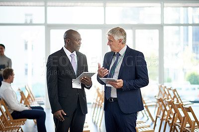 Buy stock photo Businessman, tablet and talk for networking at convention with app, introduction and schedule for meeting. People, exchange contact and tech for planning, calendar or chat at international conference