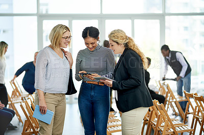 Buy stock photo Business people, meeting and network sharing with tablet for expo, conversation or discussion. Happy group, team or employees with smile or technology for tradeshow, app or chat together in workplace