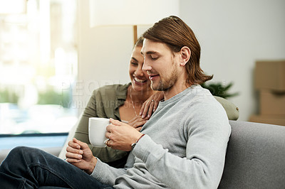 Buy stock photo Coffee, relax and smile with couple on sofa in living room of new home together for bonding. Drink, happy and moving day with people in apartment for connection, relationship or wellness on weekend