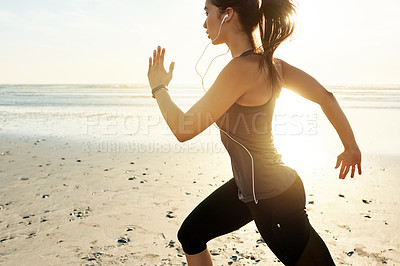 Buy stock photo Workout, running and woman on beach with music, sunrise and commitment to healthy outdoor fitness. Earphones, training and girl at ocean for morning exercise, body wellness and jogging in nature.