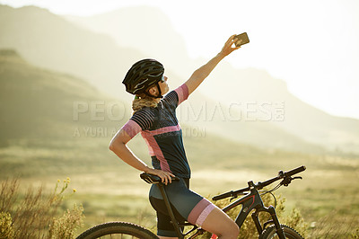 Buy stock photo Selfie, cycling and woman with fitness, bike and content creation with training. Outdoor, cyclist and person with profile picture, mountains or bicycle with practice, memory or travel with influencer