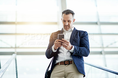 Buy stock photo Escalator, low angle and businessman with phone for travel, commute and arrival in airport lobby. Conference, professional and person on electric stairs on mobile app for flight schedule or trip info