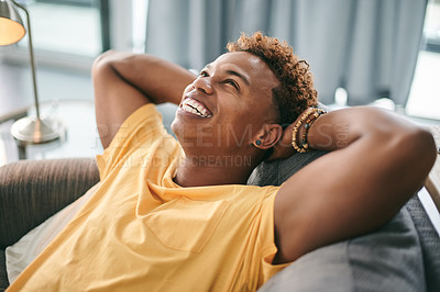 Buy stock photo Happiness, man and stretching on couch, home or stress relief in lounge, think or calm in apartment. Pride, African person or comfortable on sofa, positive attitude or rest on weekend, smile or break