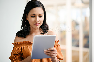 Buy stock photo Business woman, tablet and typing for planning, news and research in office with coffee and notebook. Graphic designer, technology and design in workplace for digital agency, website and social media