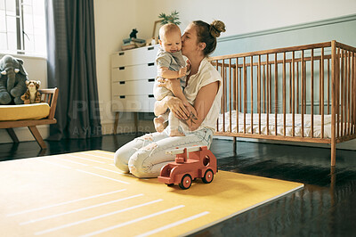 Buy stock photo Mother love, baby and kiss in home, bonding and having fun together in house. Development, childhood and mama kissing child, kid or newborn, affection and care while enjoying quality time in nursery.