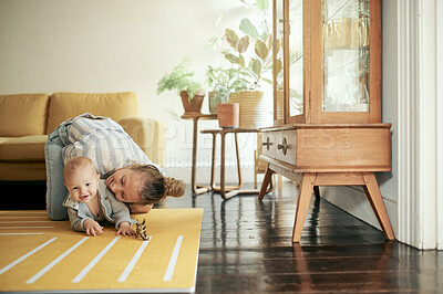 Buy stock photo Baby, embrace and mother bonding with newborn on the floor of a house or home and playing together. Care, motherhood and single parent or woman having fun with infant or kid with happiness