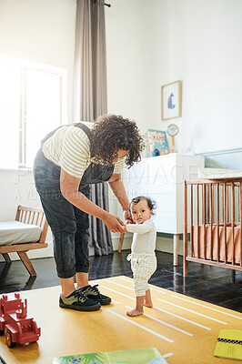Buy stock photo Mother, baby portrait and learning to walk, education and bonding in house. Care, development and mama teaching kid, toddler or newborn walking, holding hands and balance, support and first steps.