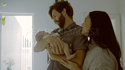 Buy stock photo Mom, hug or dad with newborn in a family for care, love or bond together for child development. Parents, relax or father with mother or infant baby for support, trust or comfort in lounge at home