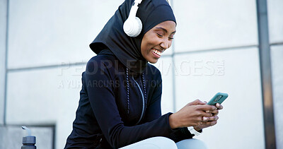 Buy stock photo Headphones, fitness or muslim woman with phone outdoor, listen to radio or streaming song with smile. Hijab, happy runner and black person with mobile, music and audio break  with podcast in city