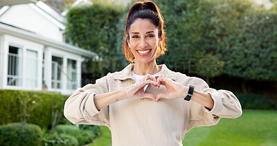 Buy stock photo Portrait, fitness and happy woman in backyard with heart hands, optimism and self care for vitality. Mature person, smile and outdoor by home with love sign, emoji and positive attitude for wellness.