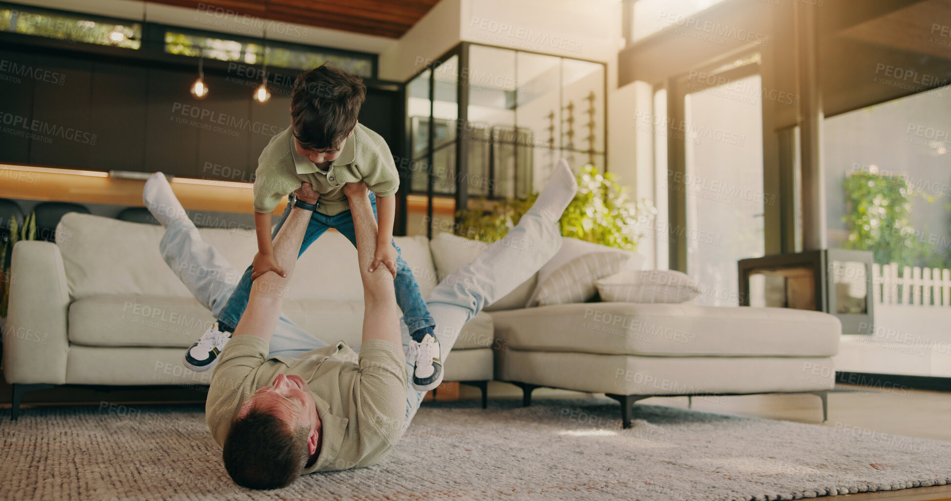 Buy stock photo Fun, father and child on floor with lifting, happy moment and bonding together with home playtime. Smile, dad and kid with family game, parent connection and quality time with playful relationship.