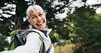 Portrait, old woman and hiking in forest with selfie, photography and social media for travel post. Happy, senior person and pov in nature for backpacking, profile picture update and capture memory