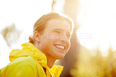 Buy stock photo Smile, hiking and relax with man in nature for adventure, wilderness explore and wellness. Happiness, health and trekking with male person in forest for eco tourist vacation, peace and journey
