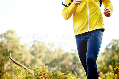 Buy stock photo Legs, running and person in woods, fitness and exercise with training, wellness or endurance. Closeup, athlete or runner in forest with sportswear, energy or hobby for practice in healthy challenge