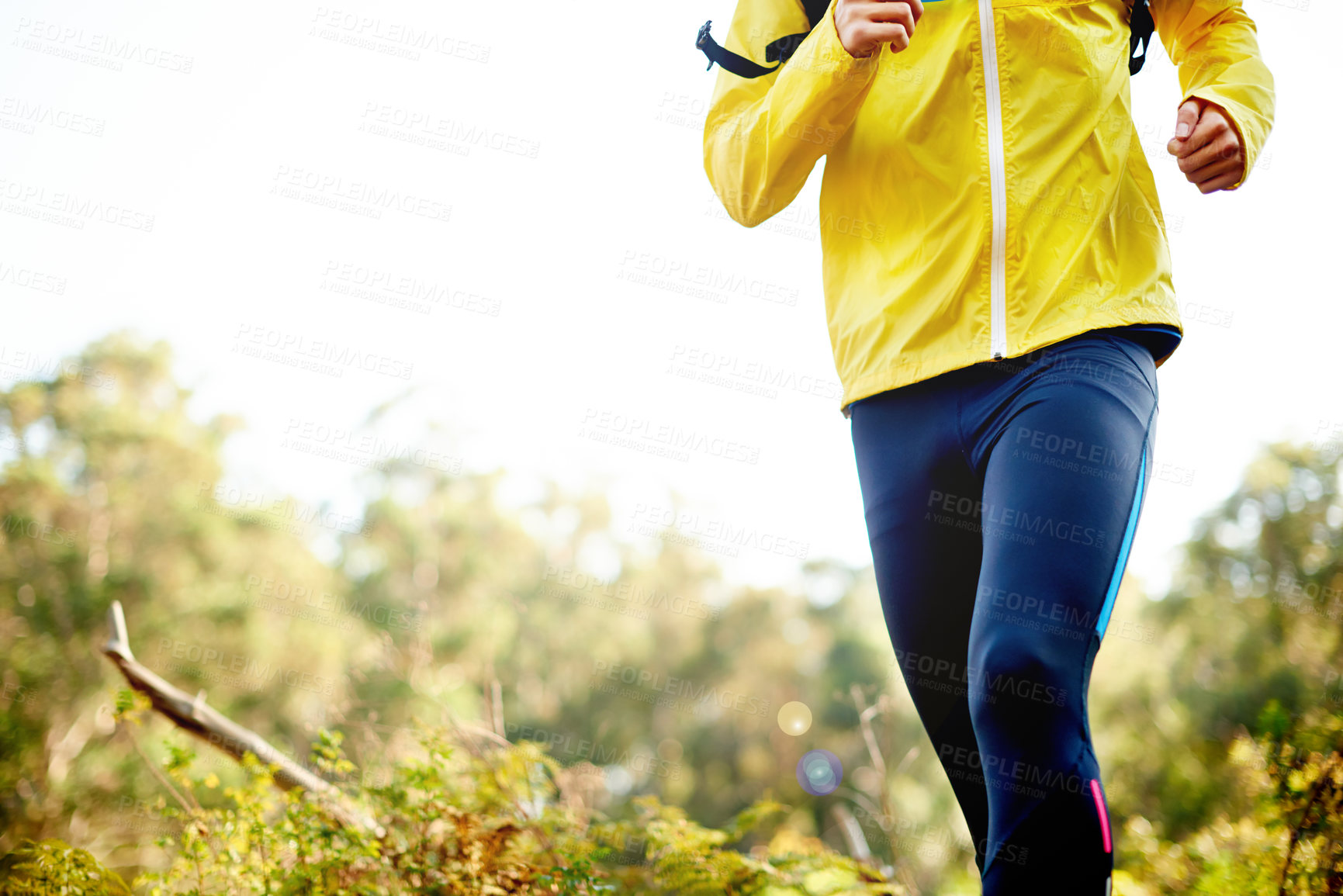 Buy stock photo Legs, running and person in woods, fitness and exercise with training, wellness or endurance. Closeup, athlete or runner in forest with sportswear, energy or hobby for practice in healthy challenge