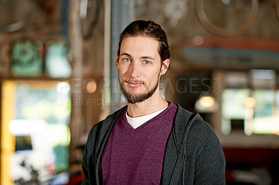 Buy stock photo Portrait, garage and man with startup, bike repair and maintenance with skills, pride and confidence. Person, entrepreneur and business owner with restoration expert, industry and professional