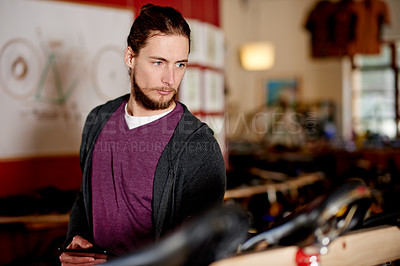 Buy stock photo Thinking, mechanic and man with tablet, bicycle shop or digital record of service in small business. Online, entrepreneur and person with tech for repair cost, reflection or idea for maintenance bike