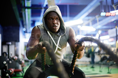 Buy stock photo Black man, exercise and battle rope at gym for muscle, development and power with workout for growth. Person, training and fitness for strong arms, intense and endurance for progress at health club