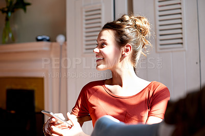 Buy stock photo Home, teenager and girl with smartphone, smile and relaxing with social media, funny meme and texting. Apartment, mobile user and happy person in living room, cellphone and message to contact and app