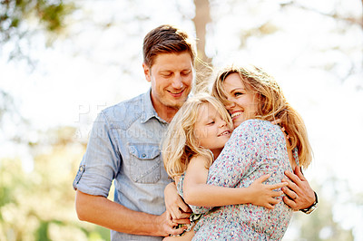 Buy stock photo Outdoor, family and relax in park with hug, bonding and love on summer holiday for childhood memory. Happiness, mother or father on vacation with child, travel and adventure for wellness trip.