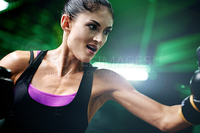 Buy stock photo Boxing, punching and gloves with woman in gym for kickboxing exercise, fitness or self defense. Martial arts, fight training and combat with person in ring for workout, boxer and intense sport