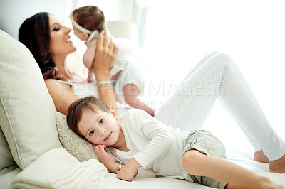 Buy stock photo Baby, mother and portrait of boy on bed in home together for bonding, family time or relationship. Growth, maternity or security with woman, son and daughter in bedroom of apartment for wellness