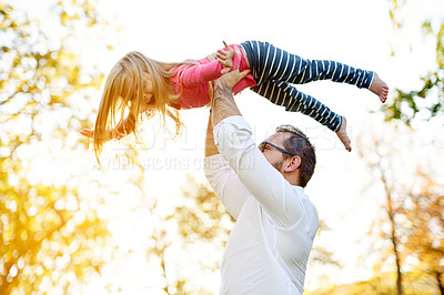 Buy stock photo Father, girl and airplane with games at park, lift and happy family by trees, nature and bonding in summer. People, dad and child with flight, playful and excited with smile outdoor in New Zealand