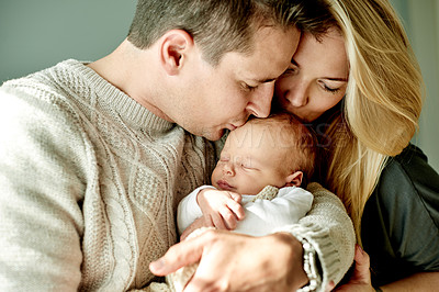 Buy stock photo Happy, kiss and parents with baby in home for bonding, healthy relationship and love for affection. Family, parenting and embrace with dad, mom and newborn for comforting, trust and security together