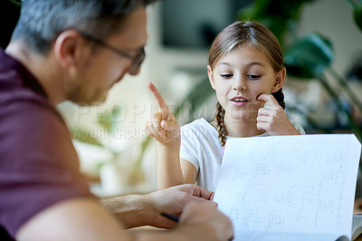 Buy stock photo Father, child and book for education at house for study notes, homework and helping with learning. Mature man, kid and reading for literature revision, homeschool activity and bonding in living room