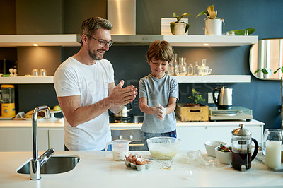Buy stock photo Cooking, pancake and learning with father and son in kitchen for help, breakfast and support. Food, ingredients and batter with man and child with bowl in family home for teaching, bonding and love