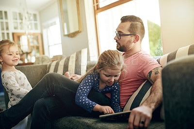 Buy stock photo Relax, father and children on sofa with tablet for playing games, streaming cartoon and bonding. Tech, parent or daughter on couch with digital kids app, watching video or entertainment in home.