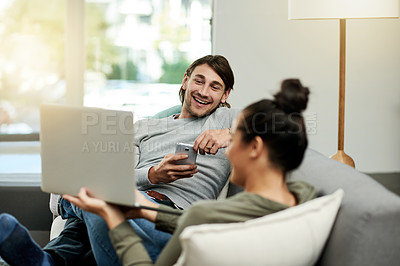 Buy stock photo Conversation, laptop and sharing with couple on sofa in living room of home together for break. Computer, phone and showing with people talking in apartment for connectivity, browsing or social media