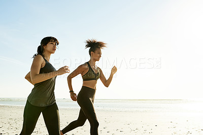 Buy stock photo Training, women and friends running at beach for workout, fitness and health outdoor in nature. Team, runners and exercise by ocean together for endurance, cardio and jog for sports with space
