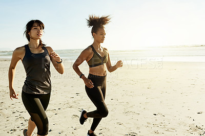 Buy stock photo Training, women and friends running at sea for workout, fitness and body health outdoor in nature. Team, runners and exercise at beach together for endurance, cardio and jog for sports with space