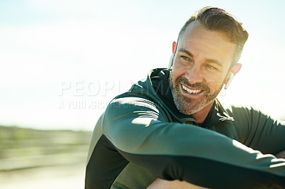 Buy stock photo Happy man, thinking or workout break for outdoor running, fitness training or exercise space. Relax, song playlist or runner with music earphones in practice for health, resting or sports recovery