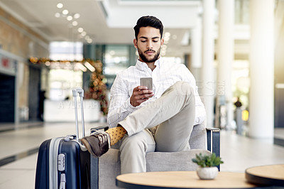 Buy stock photo Business travel, employee and man with smartphone, airport or communication for schedule and online. Scroll, website and person with suitcase for international trip, waiting and check booking details