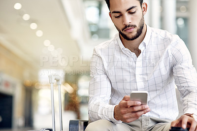 Buy stock photo Business, travel and man at airport with phone for notification, check schedule or online booking. Flight, mobile and employee waiting at lobby with app for journey, immigration and trip with bokeh