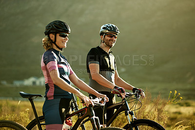 Buy stock photo Cycling, smile and fitness with couple in nature for workout break, relax and bonding together. Wellness, triathlon training and resting stop with man and woman with bicycle outdoor for bike team