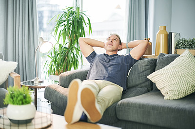 Buy stock photo Stretching, relax and man on sofa with thinking, rest and break on weekend for peace in living room. Person, calm and comfortable on couch with lounge, chilling and morning reflection in apartment