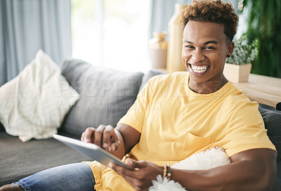 Buy stock photo Man, student and smile with tablet in living room for scroll, internet search or ebook app for learning. Happy, black person and tech for elearning application, university network and connect in home