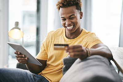 Buy stock photo Smile, student or tablet with credit card on sofa for college loan payment, banking app or debt free. Relax, african person or happy with tech in home for university tuition fees or bills transaction