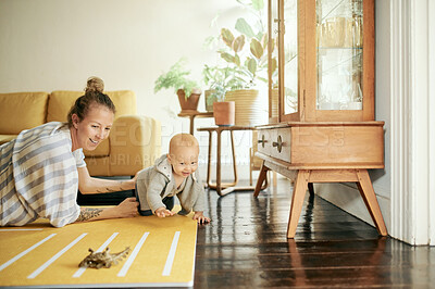 Buy stock photo Family, play and mother and baby with toys in home for bonding, quality time and relax together. Living room, love and happy mom with kid playing for child development, care and fun on weekend