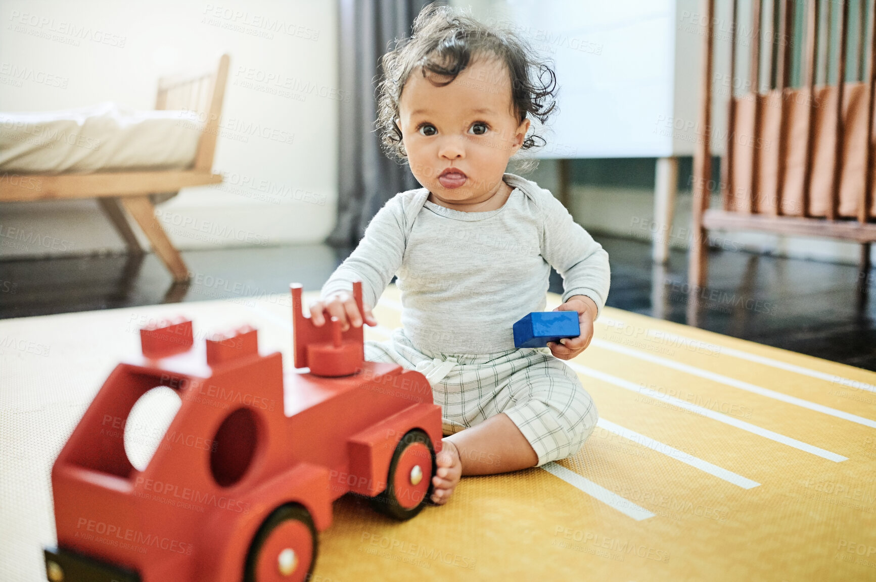 Buy stock photo Toy truck, baby play and portrait in home, having fun and relaxing in house nursery. Development, childhood and playful and cute child, infant or newborn playing with toys, red car and learning.