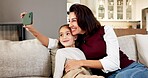 Happy, mom and kid in home with selfie, profile picture and social media post for childhood memories. Woman, girl child and smile in living room with photography, family or relax together on weekend.