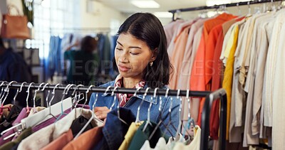 Buy stock photo Shopping, search or woman in store with clothing rack, outfit check or decision in trendy style. Retail, option or customer in boutique with rail, garment choice or selection in fashion purchase.