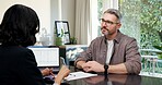 Man, meeting and realtor in office with document, application and lease form for real estate. People, consultant and laptop in workplace with contract, new listing and guidance for property purchase