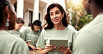 Woman, talk and team with tablet for volunteering, sign up and appoint task of community outreach. Smile, coordinator and people with digital for charity, participation and job allocation for welfare